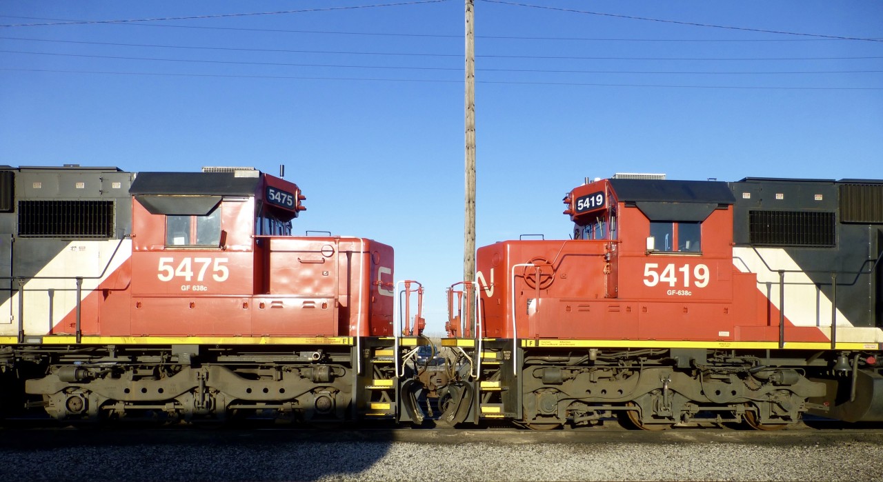 Face to Face. 4/14/16. CN SD60"s 5475/5419 (ex GMTX  9063/9055)
await servicing at Mac Yrd diesel shop.

Canadian National (CN) acquired 90 second-hand EMD SD60 locomotives originally built for Oakway Leasing (later managed by GATX/GMTX). The former GMTX/Oakway units were repainted and upgraded to CN specifications, and assigned to the CN 5400–5489 number series. 
 
Background: Built between 1984 and 1995, these 3,800-horsepower locomotives were leased to Burlington Northern and BNSF in an Oakway blue and white livery before CN purchased them around 2012. 
Acquisition Details: CN purchased a large batch of ex-GMTX/EMDX SD60s to offset power shortages. The transaction included 90 units in total. [1, 2]
Operational Status: While most were upgraded and repainted into CN's standard paint scheme (and many saw heavy mainline use, such as on train L506 in Minnesota), several have been sidelined for maintenance or retired as the fleet ages.