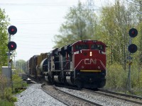 5/19/16  An eastbound to Mac Yrd train led by CN #8101 moves through the turnouts at Tansley  and onto the north track that runs between Tansley and Ash on the Halton Sub.
CN 8101 ex EMD 1208  is one of 4 SD70ACe-P6, Ex-EMDX Demonstrator units that CN purchased. 8101 is painted in CN's latest paint scheme. A far cry from the EMD silver and blue  demo colours!
