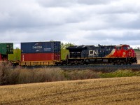 CN 3272 leads a long intermodal train down the Three Hills sub. 