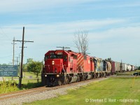 Continuing with the CSX/Chessie/C&O in Canada photos that some are posting right now, 
Here's Train D725 in the final months of operation between Sarnia and Chatham - the right of way is pristine, not a weed in sight. Big trains are operating daily on the 50 miles between Sarnia and Chatham/Blenheim, and the Rail Traffic Controller (RTC) is busy. Soon this will all change: the CSX RTC would go from handling three movements on mainline track per day each way between Blenheim and Sarnia, to basically one each way, but only operating three days a week. Imagine that, having a dispatcher basically in the chair for a Branchline, which is what this line became between 2006 and 2013. The RTC office was closed in October 2013 and the entire line became what it is now, yard limits, and operated out of town "as needed". I'm not counting the yard jobs that operated since they didn't need RTC permission - but there were 4 to 5 daily in 2005 and today, 1 to 2 daily with pretty much nothing operating on Sundays. To listen to the RTC's audio check out <a href=http://www.railpictures.ca/?attachment_id=25773 target=_blank>This link</a> and a few more I posted here in earlier years<br><br>Note this line is basically still mostly intact. I have heard there may be a washout south of Sombra somewhere. Anyone have any info? Also I've heard the Ridgetown station is about to be demolished. Might be some artefacts going into the dumpster..
