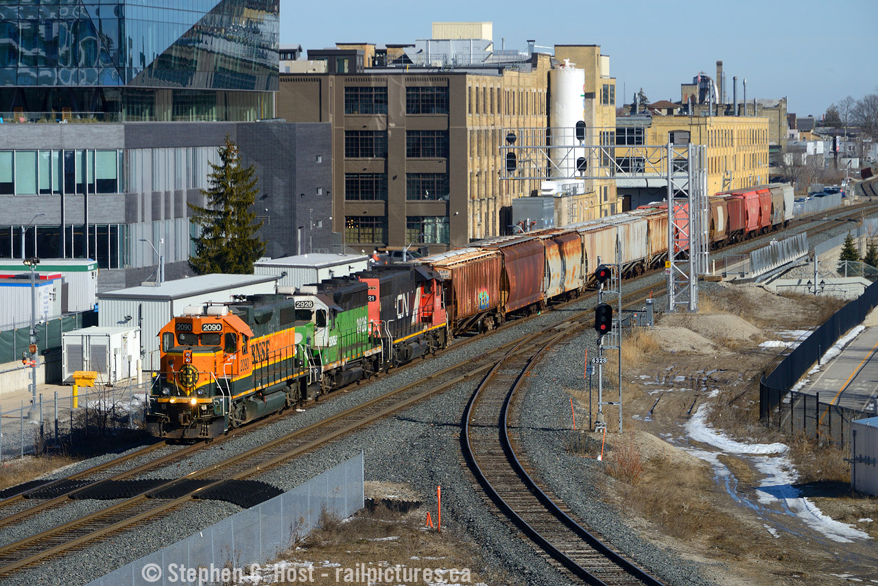 What a difference a few years makes. When I first spent time around here, there was some kind of business jutted in the middle of the Huron Park Spur and the GEXR mainline. Then a layover yard was built. Google has since sprung up, built three buildings, and large condos are now built all around this site. That business located by the tracks was razed and a parking garage was built for exclusive use by Google. Us Kitchener area "locals" anticipated the day it would open for nice vantage points for us non drone photographers. Unfortunately, the garage is all locked down, can't even walk in anymore without a FOB. Every single access point is locked down due to the 'encampment' located nearby. Rats. Well, it was good for a year or two while it lasted. Pictured is 568 departing in the "BNSF Era" which also has since ended - all of these are renumbered or repainted.