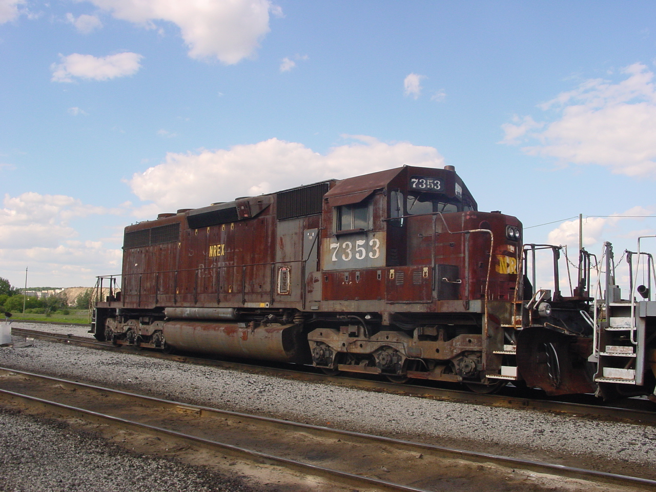 Talk about being a little worse for the wear.

Ex Southern Pacific SD40R 7353 sits at Mac Yard on 6/20/2004
Southern Pacific Railroad SD40R 7353. Built as road number 8449 in April 1966 on EMD Order 7861, it was rebuilt to SD40R 7353 in February 1981, retired from the UP December 23, 1998, later became NREX 7353, and later still became FWWR 2016

I don't use another persons photo, but you can look up this locomotive on Google and see what it looked like in its prime.
A beautiful shot of 7353 leading with Mt.Shasta can be seen at this link
https://www.facebook.com/groups/350648048350702/posts/9314445285304222/