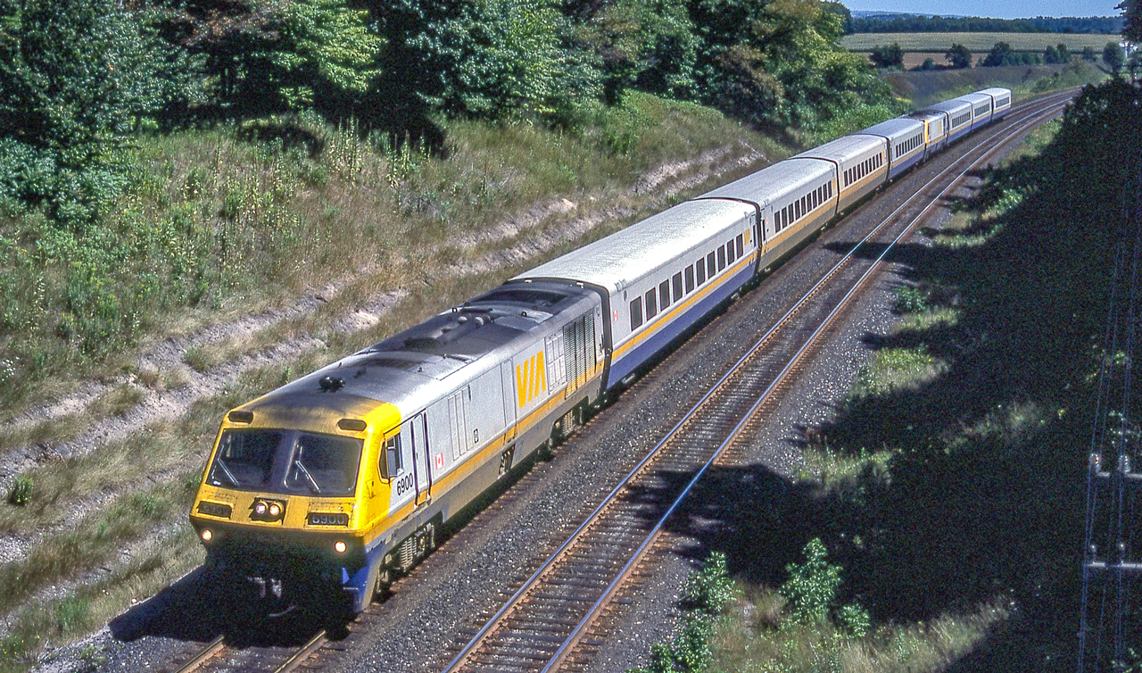 VIA 6900 heads two VIA LRC trains running as one in Wesleyville, Ontario on August 6, 1987.