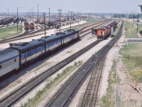 <br>
<br>
 VIA #9, the Toronto section of the daily Canadian, rolls into Mac Yard,
<br>
<br>
 At Union #9's  operating crew noted a serious leak in the steam line between baggage #613  and coach #127....
<br>
<br>
 ….a routing into Mac was arranged to allow the CN pipefitters to attend to the matter.
<br>
<br>
 VIA#9 power:  6502 - 6610 - 6612 - 6635  ( FP9A – F9B – F9B – F9B )
<br>
<br>
  At right the CN lashup includes 9523 – 5039 – 95xx – 9449 – 4229 [GP40-2L(W) /  SD40 / GP40-2L(W) /  GP40-2L(W)  / GP9 ]
<br>
<br>
 at CN MacMillan Yard:  VIA #9, Toronto section  of  'Canadian' ,  July 6, 1986 Kodachrome by S.Danko
<br>
<br>
More
<br>
<br>
<a href="http://www.railpictures.ca/?attachment_id= 43446"> another view  </a>
<br>
<br>
Noteworthy
<br>
<br>
From CP Sudbury VIA#10 operated on the CP Parry Sound Sub to CP Reynolds, backing onto the CN at Boyne then the Bala Sub to Washago and onto the CN Newmarket arriving at Union facing East, 
<br>
<br>
<a href="http://www.railpictures.ca/?attachment_id= 8406"> Glacier Park at CN Boyne  </a>
<br>
<br>
VIA #9 operated north on the Bala to Doncaster onto the York Sub  to Snider, then north on the Newmarket to Washago and onto the Bala to CN  Boyne (switch points facing north) then onto the connecting track to CP Reynolds (switch points facing south) on the Parry Sound Sub.
<br>
<br>
<a href="http://www.railpictures.ca/?attachment_id= 50851"> west on the York  </a>
<br>
<br>
sdfourty