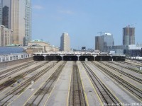 From one of my first rolls of digital film comes this gem of a shot. Yes, it is the same place you're thinking of, but before many, many different changes.<br><br>A very bare looking Toronto Union Station and surrounding area, looking east from the Skywalk to the train shed, September 2005. A few things missing have since been added, and a few other things have since been changed.<br><br>The funny thing is, most of the platforms here were and are long-disused, with GO and VIA both preferring to load trains under the train shed (with no trespassing on the platforms for photos!). The only train that regularly used them was The Canadian when it loaded on Track 9. One wonders if utilizing all the spare platform space at both ends of the train shed could help with station capacity issues.