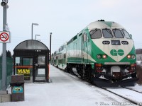 You won't find too many photos of GO Transit 647 as an MP40PH-3C, as the new unit (delivered August 2010) only lasted in that state for less than two years before it was sent back to MotivePower in May 2012 for rebuilding into a Tier 4 emissions compliant "MP54" (initially to be powered by a single Cummins QSK95, later changed to dual QSK60's).<br><br>Here it is pushing the first Barrie-line PM rush hour train of the evening, #801, out of Rutherford GO Station one cold winter's day in February 2011. That GO F59 & MCI coach logo on the trash can was used by GO for publicity purposes on a number of things over the years, including on their employee's paper paystubs at the time.
