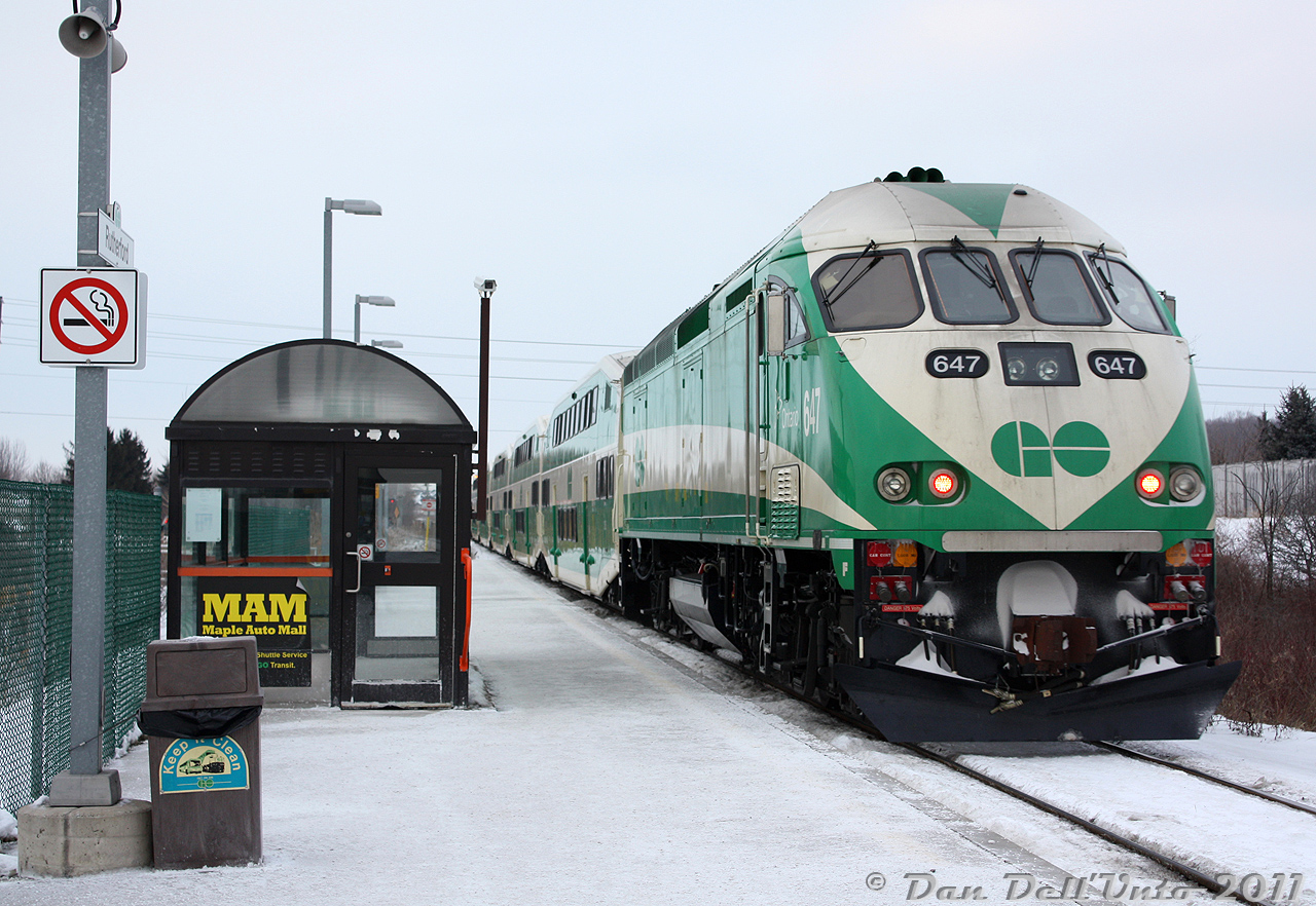 You won't find too many photos of GO Transit 647 as an MP40PH-3C, as the new unit (delivered August 2010) only lasted in that state for less than two years before it was sent back to MotivePower in May 2012 for rebuilding into a Tier 4 emissions compliant "MP54" (initially to be powered by a single Cummins QSK95, later changed to dual QSK60's).Here it is pushing the first Barrie-line PM rush hour train of the evening, #801, out of Rutherford GO Station one cold winter's day in February 2011. That GO F59 & MCI coach logo on the trash can was used by GO for publicity purposes on a number of things over the years, including on their employee's paper paystubs at the time.