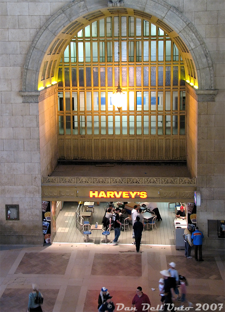 Here's a location that Steve had mentioned liking to patronize, and the "oeuf" mentioned CP crews on the downtown portlands switching job used to stop at Union to visit: the Harvey's restaurant located in Toronto Union Station's Great Hall. This photo was taken on a special GHRA private tour of John Street Roundhouse (pre-museum) and the upper vacant levels of Toronto Union Station (before GO/Metrolinx renovated them and moved in), guided by the late Toronto railway historian Derek Boles. Note the vacant 2nd level corridor above the restaurant, and 3rd floor walkway above (just a narrow walkway with a very old glass floor, like the ones on this side above the main entrances).

The Harvey's restaurant chain was owned by Cara Operations Ltd, originally the Canadian Railway News Co. (that ran those CARA news kiosks in railway stations like Union, and later became the owner of the Swiss Chalet and Harvey's franchises). According to Derek, the Toronto Terminals Railway contracted out operations of Union Station's restaurant, lunch room and two newstands to the Canadian Railway News Co. in 1956, which some speculate may have eventually lead to this location later becoming a Harvey's. Incidentally, the location of the aforementioned restaurant was the old "Oak Room" at the west end of the west waiting wing, that was demolished for the Skywalk entrance from Union, and the lunch room was the "Maple Room" (as the York Pioneer Restaurant in the 70's) in that same area, now the site of the VIA Business Lounge.

This photo may have broader appeal than just the railfan community, as it was one of those places frequented by many that was always there until it wasn't, that nobody (well, almost nobody...) bothered taking a photo of to document its existence until it was too late. It was always good for grabbing a quick bite to eat with friends (as was the case on this day after the tour) or grabbing something to eat on the cab car ride home. And just like that, it was closed in 2011 during the Union Station renovations in order to replace the location with an escalator to the concourse below.

If you watch the end of "The Silver Streak" when the train was a runaway, this spot (as "The Coffee Shop", pre-Harveys) was the first restaurant location the train dispatcher ran into the look for the trainmaster. The Oak Room restaurant nearby was the second. You can also see the train crashing through the CARA news kiosk, that I remember was still at that exact same location in 2000 with the same sign, but was gone by 2005.

Other fun facts about that area of Union was the original barber shop closing in early 2012 (also due to renovations), whose barber Bruno Villanova cut hair there for nearly 51 years - he was originally hired at Union Station not long after he came off the boat from Italy in 1961! The men's washrooms right next to it were also used to film the (politically incorrect) "blackface" scenes when Gene Wilder and Richard Prior procured some shoe polish in order to get back on The Silver Streak ("What do we want with shoe polish?!" "Just pay the man!!!").