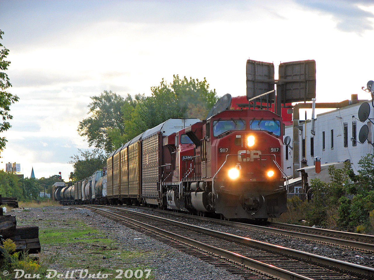 Hanging out with "The Egg", "The Frenchman" and "The Foamductor" one day at the infamous Bartlett Avenue crossing along CP's North Toronto Sub (where shenanigans were known to happen, from time to time) yielded a good number of trains, and quite a few with the then-populous CP SD9043MAC units. Here, CP train #222 has SD9043MAC 9117 on point with ES44AC 8786 as they climb upgrade on the stretch from from Davenport Diamond to Bartlett Avenue in the evening light.