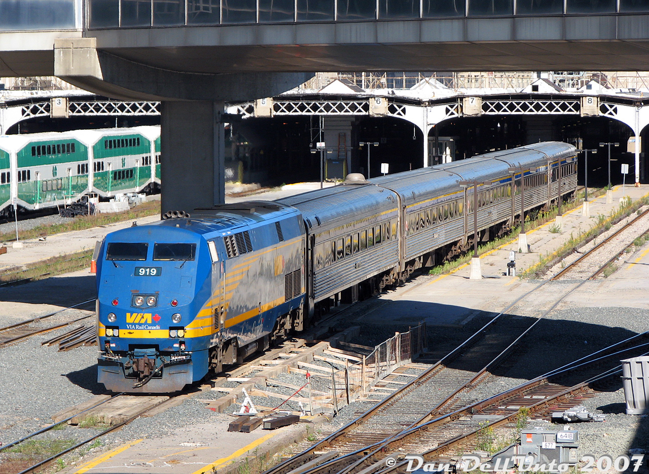 One for the "remember when the P42's were everywhere" files, now that VIA P42DC 919 is one of the retired units facing scrapping in the near future: 919 backs her consist of 5 HEP Budds from the TMC into Union Station on Track 8 during PM rush hour, likely the equipment for train #83. After loading passengers at Union, it will depart westbound around 5:15pm-ish for the Oakville Sub.

The consist for the evening was VIA 919, 4004, 4118, 4122, 4116, and 4121. Hard to believe those 1940-50's Budd stainless steel cars might outlive the entire P42 fleet...