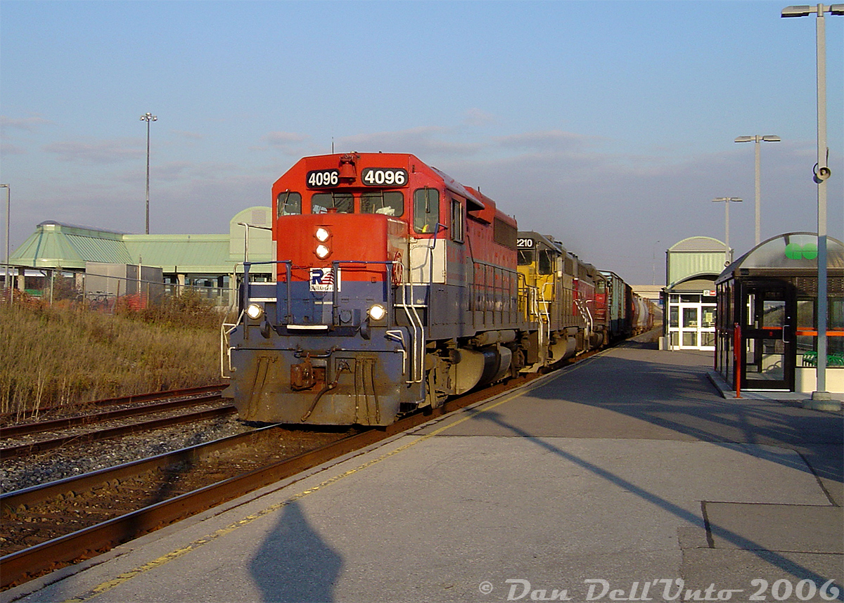 Wasting no time after picking up their train at CN's MacMillan Yard, GEXR #431 speeds through Bramalea GO station with RLK GP40 4096, LLPX GP38 2210 and GEXR GP40 4019, "Beating the GO rush" and making a run for the grade up to Mount Pleasant before the first Georgetown-line GO train is due. The trip back was when GEXR #432/431's power got tested the most: track profiles show the elevation climbs from about 600 feet above sea level at Bramalea to 800 feet at Mount Pleasant, drops a bit for the Credit River, climbs again to almost 900 feet by Georgetown, and rises to 1200 feet for the grade through Limehouse/Acton.