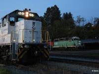 At dusk, a local BNSF switching job with BNSF 1507-BNSF 2536 is about to wrap up for the evening at Brownsville Yard. Meanwhile, in the foreground, a DP World Logistics switching unit switches container flats.