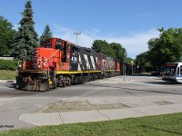Two years ago today, CN 540 begins its trek down the Huron Park Spur (HPS) with CN 4116-CN 4791 for power. It is pictured crossing Victoria St. @ Walnut St.