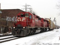 Two classic GM ponies rolling through midtown Toronto: CP SD40-2's 5776 and 5720, in well-worn matching "CP Rail System" paint, handle a long train of autoracks on #137 at Bartlett Avenue on the North Toronto Sub. CP 5776 would be retired later that year and be rebuilt as SD30C-ECO 5043, while 5720 would be retired in 2009 and sold to J&L Consulting.