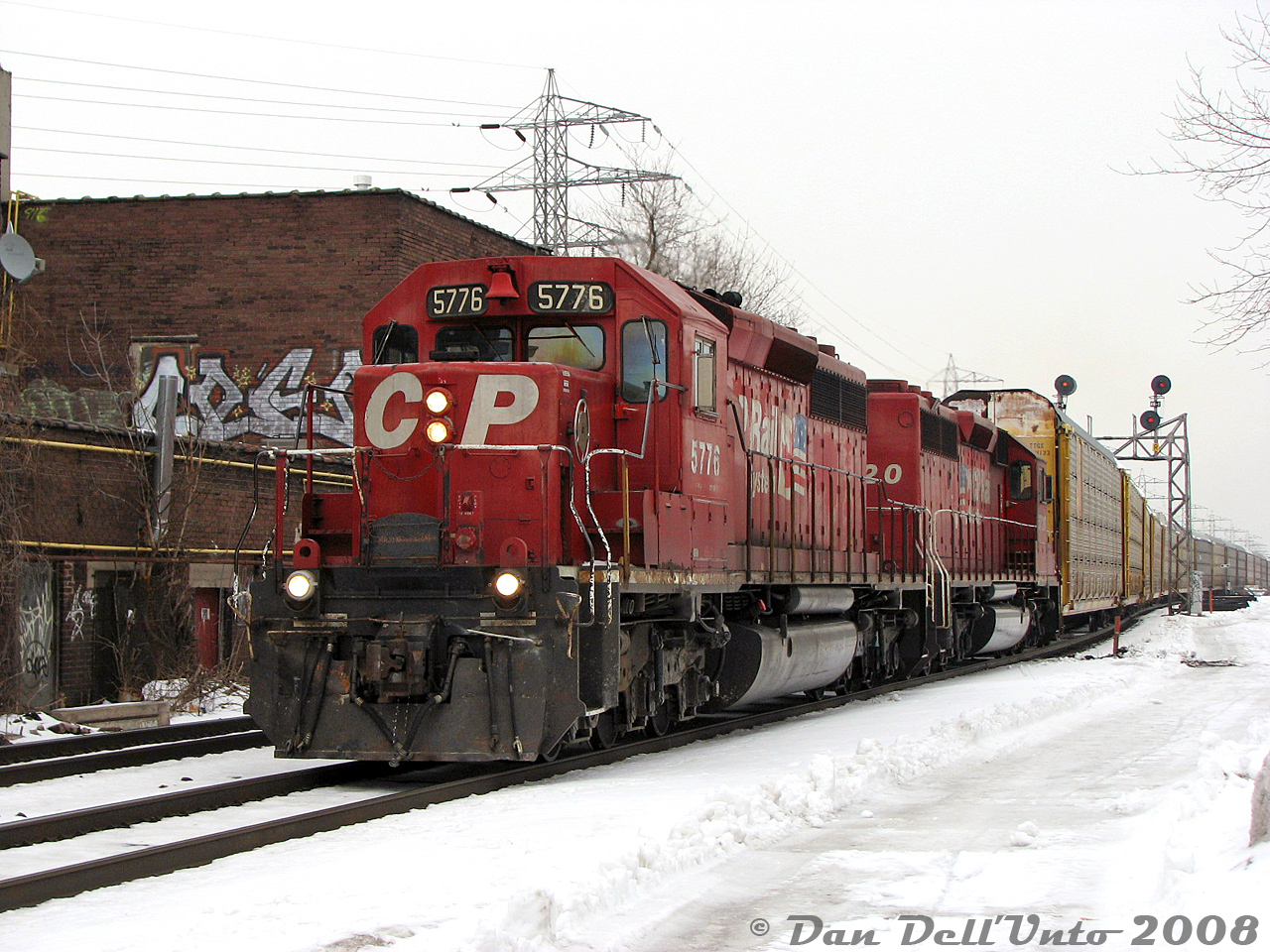 Two classic GM ponies rolling through midtown Toronto: CP SD40-2's 5776 and 5720, in well-worn matching "CP Rail System" paint, handle a long train of autoracks on #137 at Bartlett Avenue on the North Toronto Sub. CP 5776 would be retired later that year and be rebuilt as SD30C-ECO 5043, while 5720 would be retired in 2009 and sold to J&L Consulting.