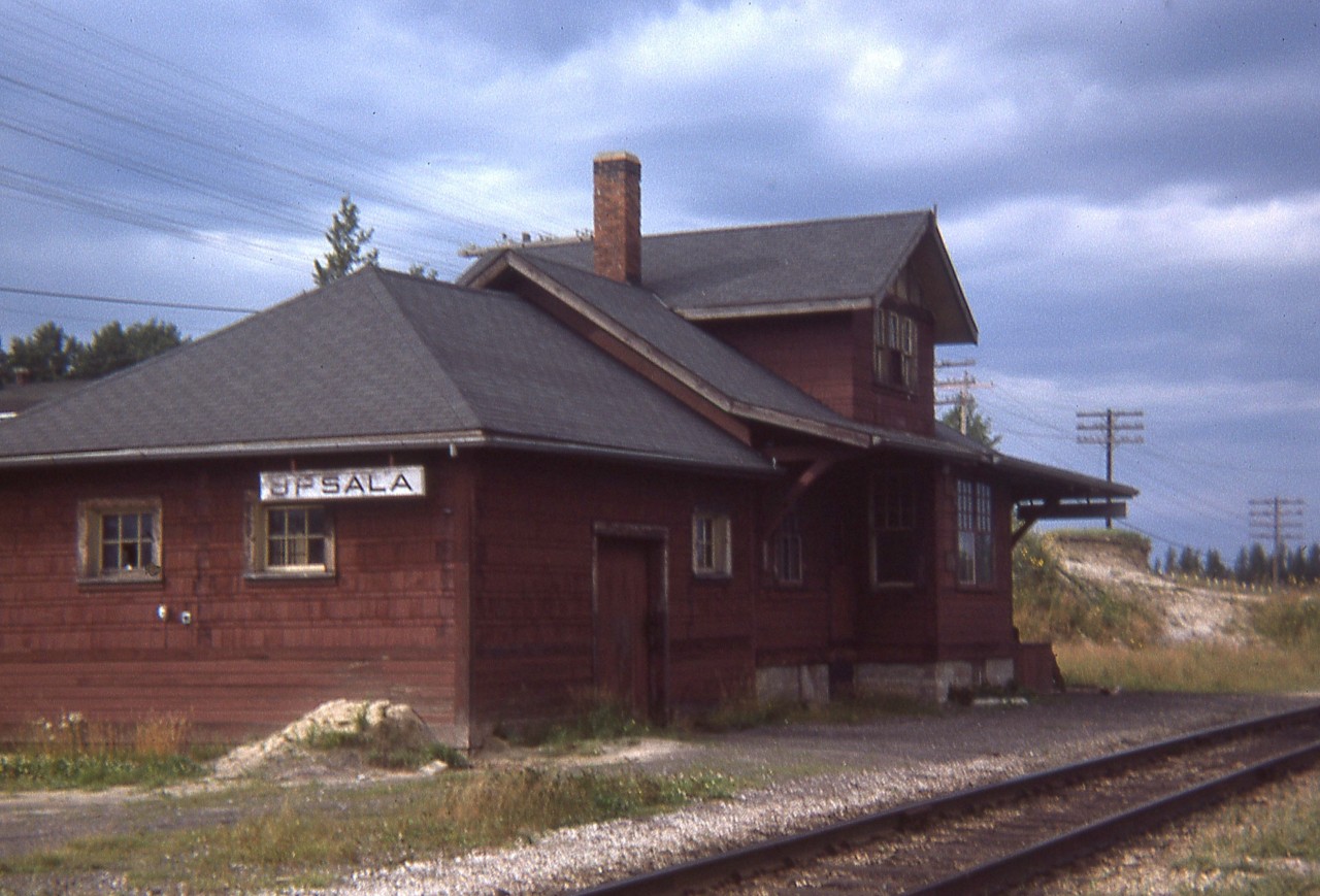 I posted an image of Upsala's CP station to railpictures.ca taken in 1975, about 10 years ago. Now I find a shot from 1974; and figured enough time has gone by for an update. 
Discussion was the original station was dismantled or just moved by truck to the Founders Museum and Prairie Village near Thunder Bay. The agreement was drawn up; but according to the site 'Canada-rail' the station caught fire and was destroyed before it could be moved. The site further goes on to state that CP supplied structural plans and the building at the museum is but an exact replica. Anyway, we do know the original is long gone from the little hamlet of Upsala............
