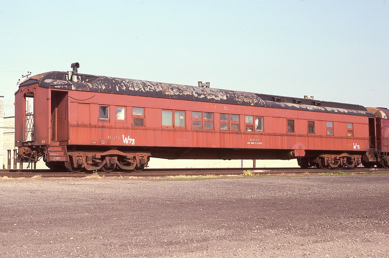 Many years ago happened upon this old CP Service car parked on a siding at Alliston. Inscription ID was 411250 and a 'W78' sloppily added, and "Cook, Diner and Sleeper" below 'Service Car' on the sides. Perhaps one of the sleuths on this site can come up with origin and demise of this old heavyweight.  Thanks!