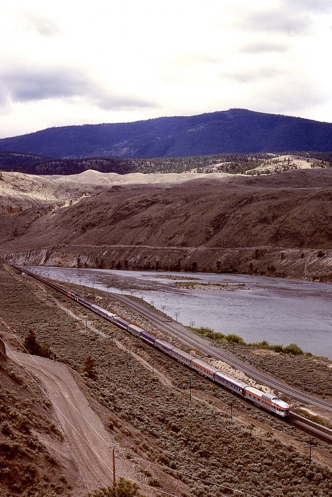 In the early years of VIA, gloriously mixed passenger train consists from CN and CP origins were common, and by seeking elevated camera perches, catching a complete train was one of my goals.  On the east side of the Thompson River at Basque, CN and CP ran parallel for a short distance, allowing interchange connections that were handy during detours for track outages.  On Sunday 1980-05-25, train No. 1 was on the CP mainline, powered by CP 1425 and VIA 1965 and VIA 1418.