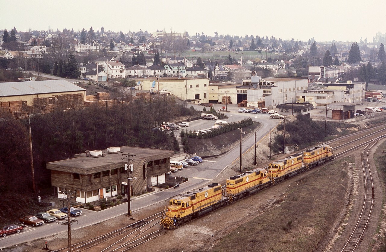 While BC Hydro had four SD38 units (one SD38AC and three SD38-2s), catching all four together was not common.  Looking eastward from the Queensborough road bridge on Tuesday 1982-03-23 provided this view of BCH 384 + 381 + 383 + 382 waiting at the Trapp Yard main office in New Westminster in preparation for taking a Valley Freight train eastward to Huntingdon interchanges with CP, BN and MILW.