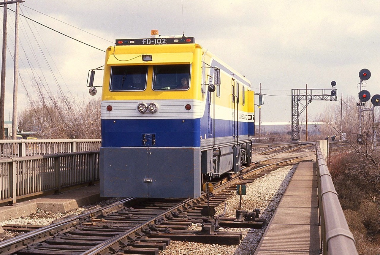 Pandrol-Jackson inspection vehicle stopped on the track to the yard in Burlington. The unit is on the bridge over Brant St. This company was taken over by Harsco Track Technologies in 1999.