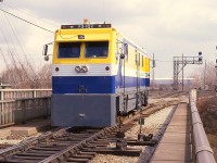 Pandrol-Jackson inspection vehicle stopped on the track to the yard in Burlington. The unit is on the bridge over Brant St. This company was taken over by Harsco Track Technologies in 1999.