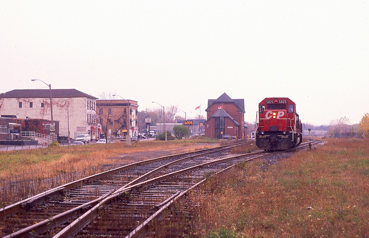 Geez. Rainy dull day at Niagara Falls.  I guess you could say, 'it figures' since I am out to catch a CP detour over the CN Grimsby. Work in the TH&B Hunter Street tunnel in Hamilton necessitated this unusual activity. Behind the CP 5825 up front is HATX 514 and CP 5862 and a rather long train. Gordy Rivers is the hogger. Nice guy that he is, he killed the ditch lights for this shot. The train is waiting for permission to cross the bridge to the USA.
I posted this image mostly for the local fans to appreciate how the area around the NF station has changed over the years.