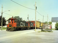 For those who have followed Railpictures.ca for a number of years will recall I posted a couple of images of the last run to Gallagher Paper (recyclers) on Pine St in Thorold.  The company had gone bankrupt and CN sent a couple of switchers to retrieve the last rolling stock at the plant, which amounted to 3 boxcars. The move is seen leaving Pine St spur for the very last time, as it rolls past the Thorold Supermarket; a nice 'prop' for identification. It wasn't easy pacing a train even though it was only doing about 10 MPH.
CN gave up this and adjacent track in the area to the fledgling PCHR (Port Colborne Harbour Rwy) soon after, but with no business left on the Pine St spur, I don't believe they ever ran anything down this stretch of track.
I believe the Pine St line has been paved over or taken up in the past few years. Haven't been along there to check.  Anyone?