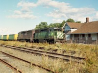 The Mamiya 645 film camera has caught CBNS 5004 and HATX 910 bringing a coal train from Sydney Mines on this beautiful late summer afternoon. I have to admit luck was riding with me, as I had just showed up to grab a photo of the now closed (1990) North Sydney station when I heard a horn not too far off. What are the odds? At the time I had no idea that Sydney Mines was going to shut down in a scant two months and business would quickly  wind down. After the closure, all activity along the line pretty much petered out and even with support from the province the CBNS finally threw in the towel, running the last train out of Sydney at the end of 2014. This marked the end of 135 years of railroad activity serving the Sydney area. The only activity now for CBNS in Cape Breton is at Port Tupper and Port Hawkesbury down on the south end by the Strait of Canso.
However the rusted tracks are still in place, and with tracks there is always hope, faint as it may be.