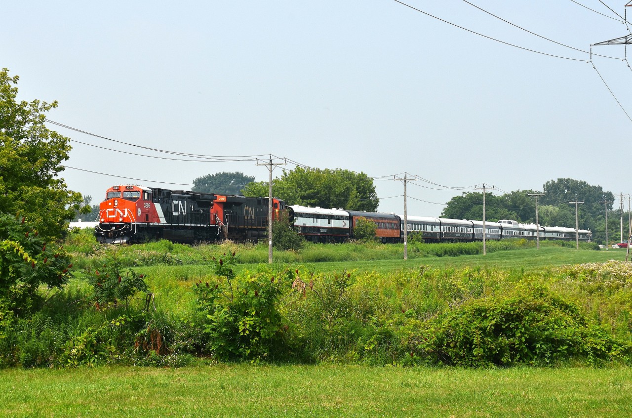 Well, since there very well could be a deluge of CN Executive Train P007 images to RP, I guess I will get mine in there too.
This image is of the trial run on Friday, July 17th. The difference between this and the official run is the second unit is 2996 rather than the ultra-clean 3412 trailing the 3309 in consist on Monday.
Looks good. A tip of the cap to the lad who clued us in this train was going to roll down thru Niagara. I'm sure all us locals know just who I am referring to. :o)  A big THANKS.
The Grimsby sub has very few very open areas to capture a train of this length, unless you are on an overpass.