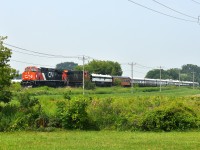 Well, since there very well could be a deluge of CN Executive Train P007 images to RP, I guess I will get mine in there too.
This image is of the trial run on Friday, July 17th. The difference between this and the official run is the second unit is 2996 rather than the ultra-clean 3412 trailing the 3309 in consist on Monday.
Looks good. A tip of the cap to the lad who clued us in this train was going to roll down thru Niagara. I'm sure all us locals know just who I am referring to. :o)  A big THANKS.
The Grimsby sub has very few very open areas to capture a train of this length, unless you are on an overpass.
