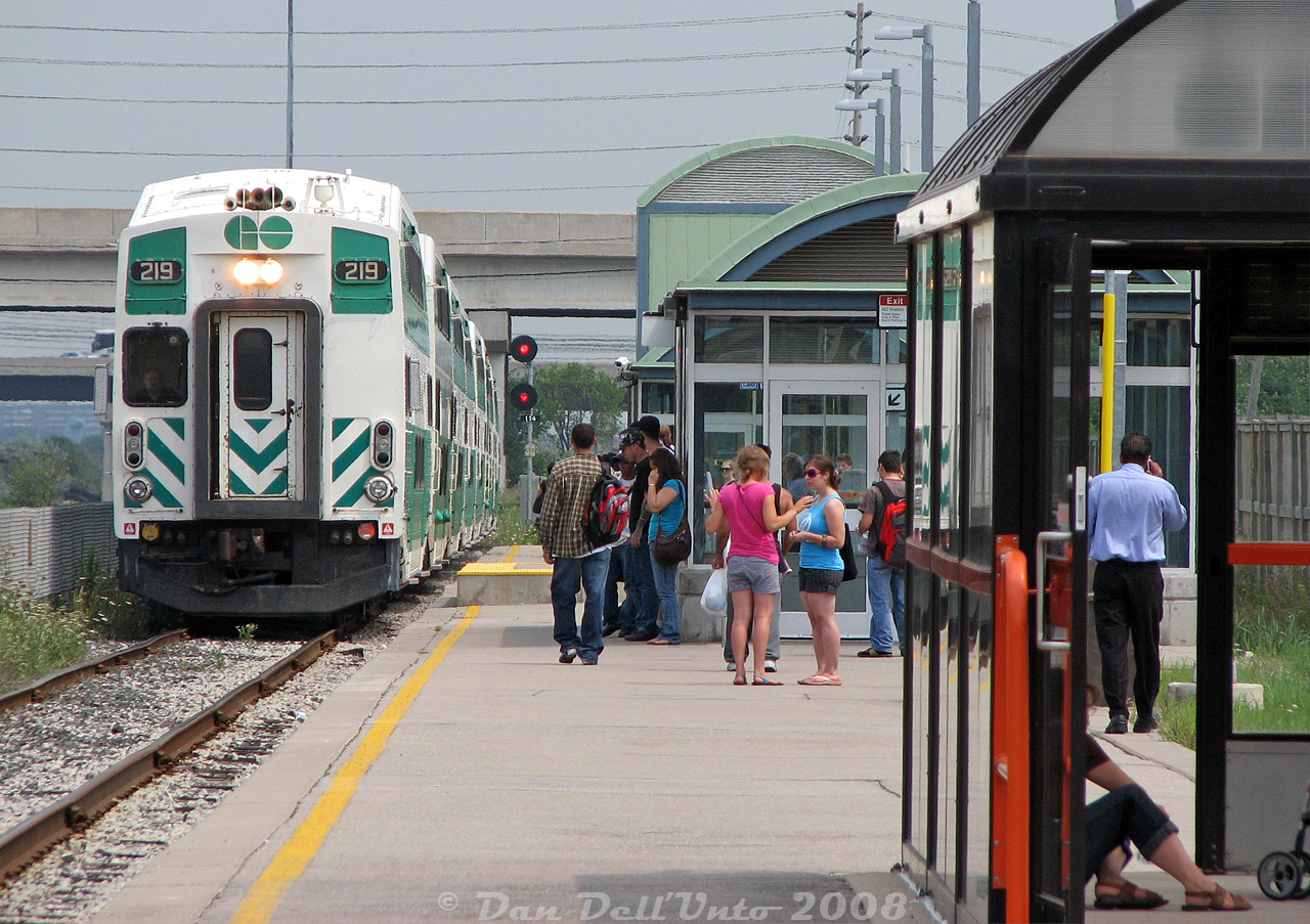 Some of the usual suspects patronizing the afternoon Georgetown line trains (Union-Bramalea service, aka the "Bramalea Flip") including students, businessmen, parents with strollers and people heading into Toronto for an afternoon or appointment downtown, wait at Bramalea GO station as train #263 with cab car 219 pulls into Platform 3 on the Bramalea commuter lead. Arrival time is 1:31pm, on-time after the train's usual departure from Union at 1pm. In about 14 minutes, the train will depart at 1:45pm back to Toronto as #266 with F59PH 523 leading on the other end, arriving on Track 1 around 2:18pm as per trip notes.Since unrebuilt 219 didn't yet have a full cab, it became our chariot of choice for the ride downtown: standing in the A-end doorway shooting out the rear window for part/most of the trip (back when one could still do that sort of fun thing).