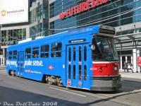 Not your typical red Toronto streetcar: TTC CLRV 4034 sports a bright blue wrap for the Bank of Montreal (BMO), paused heading eastbound on Dundas at Victoria in front of the relatively new 10 Dundas East building (now called The Tenor). The Future Shop located here, while it lasted, was handy to stop by for electronic odds and ends, but its proximity to the nearby Best Buy in the Ted Rogers School of Management building (Dundas & Bay) eventually doomed it.