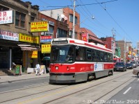 There's no mistaking the Chinatown area of Toronto: TTC CLRV 4002 (one of the original SIG prototype cars) heads westbound on Dundas Street between Huron and Spadina, passing the various Chinese businesses and shops that line this part of Dundas.