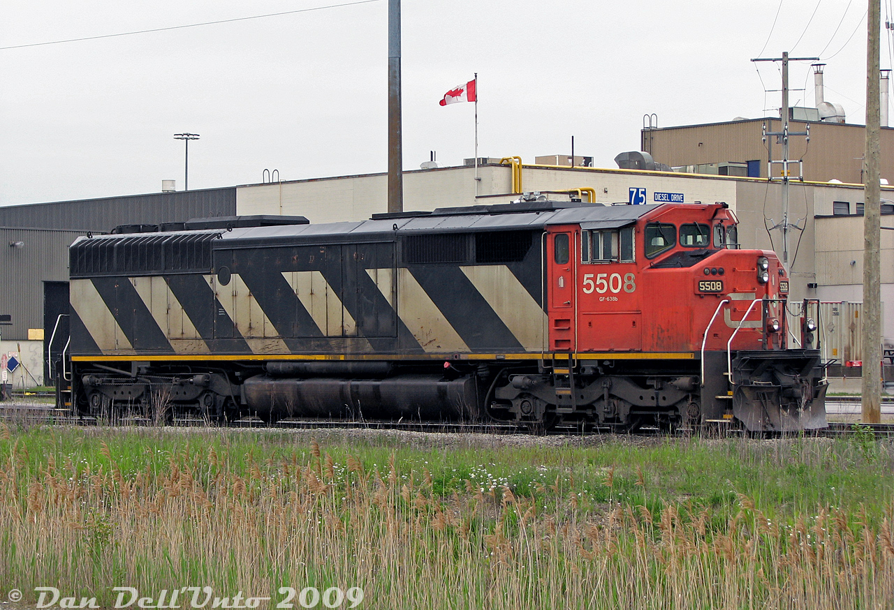 Zebra stripes at 75 Diesel Drive: CN SD60F 5508 sits stored during a traffic downturn on one of the perimeter tracks around the diesel shop (aka the "Locomotive Reliability Center") at MacMillan Yard. CN was the only railway to order the full-width "Draper Taper" cowl design with Canadian Safety Cab on their SD60F units, a continuation from the earlier SD50F and HR616 orders. A good bunch were resold after retirement, with the rest cut up for scrap.