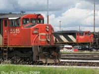 CN SD60F units 5515 and 5547 graze on the shops tracks around CN's MacMillan Yard diesel shop, part of a variety of stored 4- and 6-axle mainline power due to a traffic downturn at the time, including SD50F's, SD60F's, GP40-2LW's, and SD40-2W's and C40-8M's. They would all be reactivated and put back to work later when things picked up.