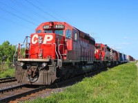 Throwing it back four years earlier to 2010, we see a westbound CP manifest freight stopped short of the signals at Bartlett Ave in Toronto's west end with a trio of SD40-2's for power. CP 6001 and the 5878 behind her were still sporting the mid-90's dual flags scheme back then, and 5878 even had it's class lights intact. This train was either a 400-class train for Sudbury or a 200-class train for Chicago...I have no notes on this guy unfortunately. I believe Mr.JA was with me this day.