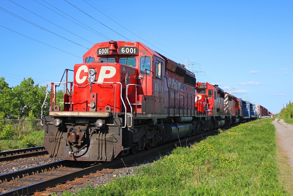 Throwing it back four years earlier to 2010, we see a westbound CP manifest freight stopped short of the signals at Bartlett Ave in Toronto's west end with a trio of SD40-2's for power. CP 6001 and the 5878 behind her were still sporting the mid-90's dual flags scheme back then, and 5878 even had it's class lights intact. This train was either a 400-class train for Sudbury or a 200-class train for Chicago...I have no notes on this guy unfortunately. I believe Mr.JA was with me this day.