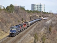 What I believe to be either M314 or M305 heads westbound uphill past Hilda Ave in Thornhill on a sunny afternoon back in the Spring of 2014. Leading the freight is a former EMDX SD70ACe painted up in the blue and navy demonstrator scheme...now under the ownership of CN. I recall CN picked these up after leasing them either in early 2014 or late 2013...not sure on the exact date.
