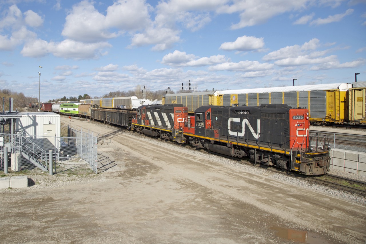 CN GP9RM's 7039 and 4138 are seen drilling cars in Aldershot yard on a warm Spring afternoon back in 2014. I'm not too sure if this was simply a yard job shunting cars around or if this was in fact a road local bound for Stuart Street in Hamilton...either way a great train to catch in the sun. I have a few more shots from this same time in May that year that I will upload this week.