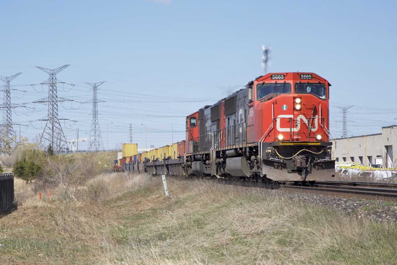 On May 6th, 2014, I was at the 14th Ave crossing of the CN York Subdivision shooting train Q149 with 5665 on the point. I had just gotten my then-new Canon 5D Mk III two months previous and was having a lot of fun taking it out railfanning that Spring.