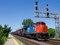 CN 322 has CN 8952 leading and TankTrain cars up front as it passes through Dorval.