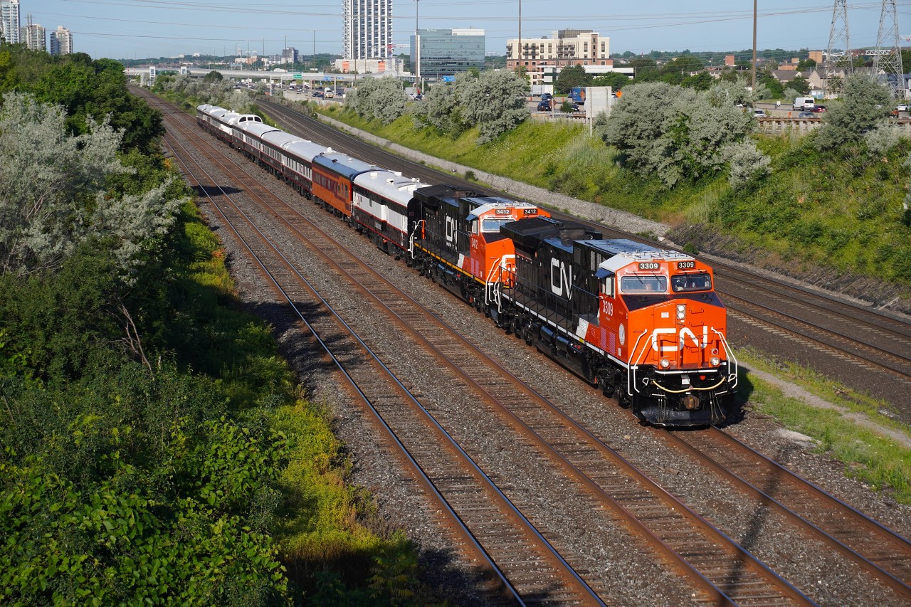 After sitting in Mac yard during the weekend, CN Business train running as CN P00731 20 with former retro logo CN 3309 leading is seen heading towards Pickering Jct again towards Oshawa. There they wyed the train and backed into the station track at the VIA station until 12:00 when they departed Westward for Niagara Falls crew changing at Milton along the way.