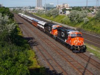 After sitting in Mac yard during the weekend, CN Business train running as CN P00731 20 with former retro logo CN 3309 leading is seen heading towards Pickering Jct again towards Oshawa. There they wyed the train and backed into the station track at the VIA station until 12:00 when they departed Westward for Niagara Falls crew changing at Milton along the way.