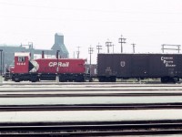 Toronto Union Station has plenty of passenger action, but on a hot hazy day in August of 1983, CP switcher 1244 passed by the south side of the station with a yard job, including old timer boxcar CP 59070. The internet claims that the unit had been rebuilt in 1982.