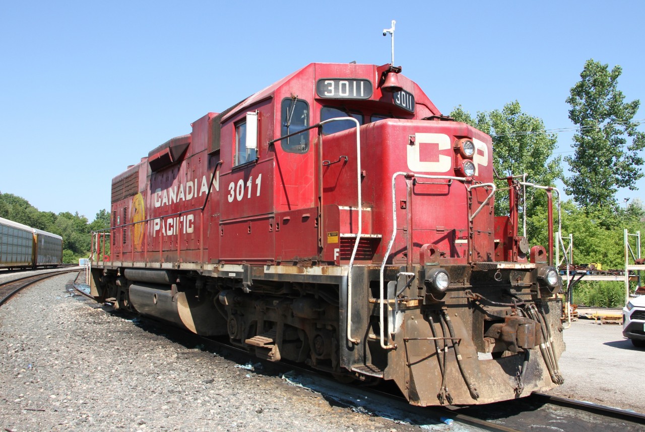 CP 3011, an EMD GP38AC is seen taking a break from assembling a consist of rail cars for the Toyota plant located across the street from Hagey Yard.