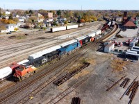 M39731 03 making their way past Brantford with CN 3033, GECX 2037, and CN 8307 leading 133 cars