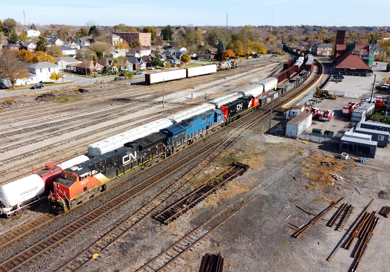 M39731 03 making their way past Brantford with CN 3033, GECX 2037, and CN 8307 leading 133 cars