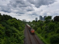 Under dramatic cloudcover, CN 5640 and 2677 make their way uphill at Hilda Ave in Thornhill, headed westbound towards a crew change at Snider West.