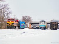 A pair of former Metrolink F59 locomotive shells, recently purchased by Ontario's Metrolinx, are tied down in the yard at Galt, set off on account of air issues affecting their movement on 2-230.  With the issues sorted, setoff complete, and coffees on board, 2-230 finally gets underway towards Toronto.