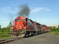 CN YRP003 heads towards a client in east end Montreal after being stopped here a bit, with none of the units loading properly (CN 7080, CN 4139 & CN 4774).